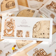 Illustration for article titled Look at all the Wonderful Wooden Gears Inside This Elastic-Powered Locomotive